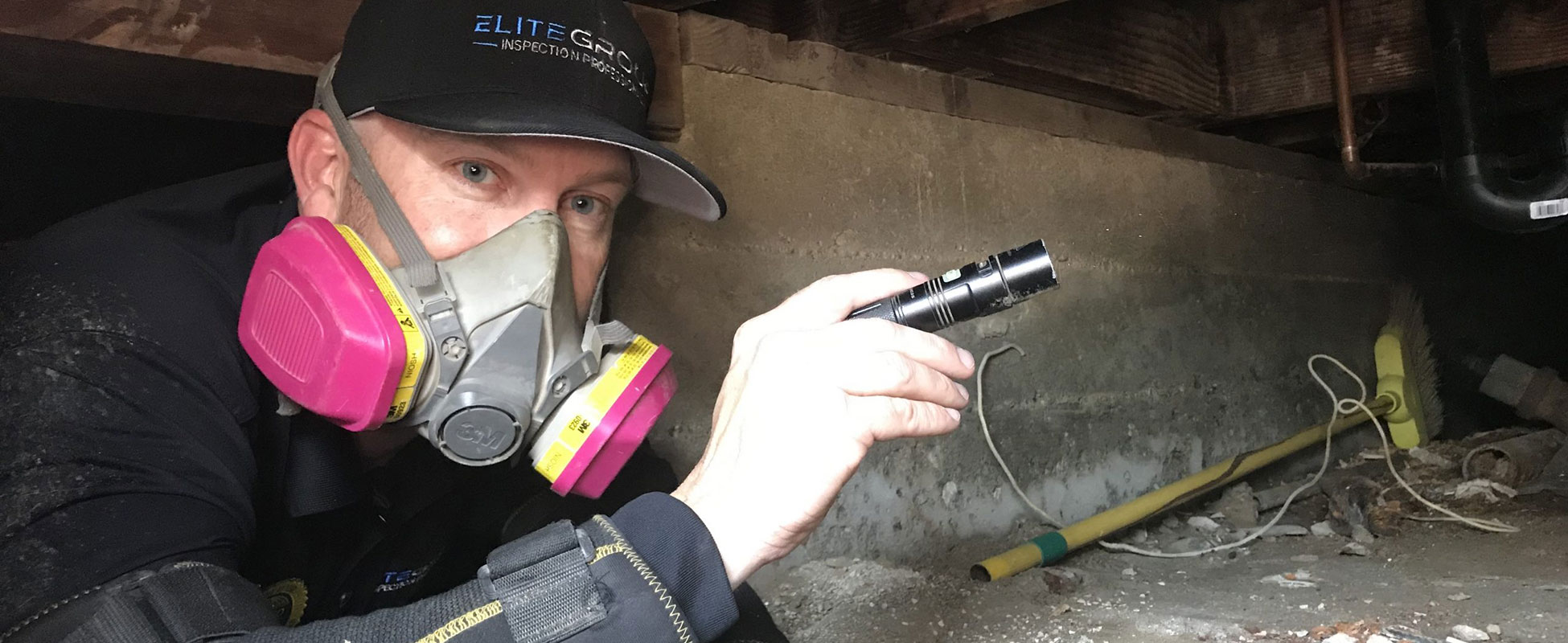 Elite Group inspector performing crawl space inspection