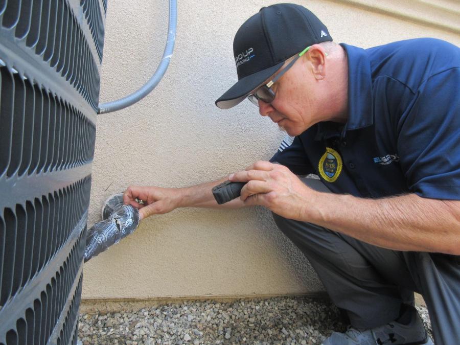 Home Inspector Inspecting HVAC lines